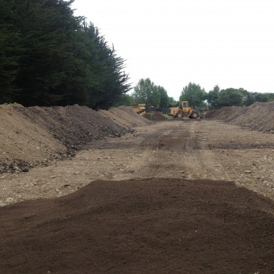 Returning the screened soil to the arena